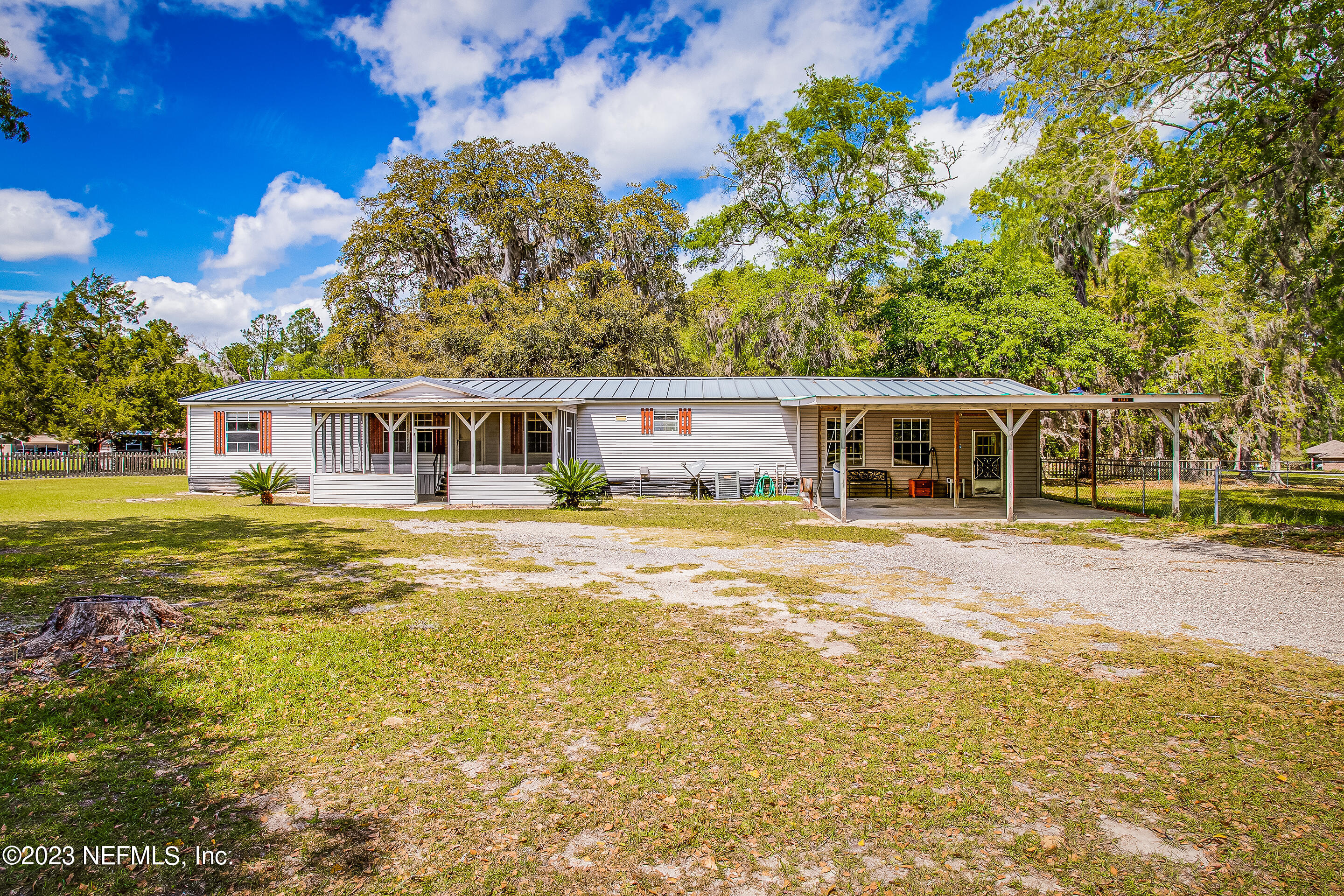 35157 Goodbread Road Callahan, FL 32011 - Photo 1 of 38 a front view of a house with a garden