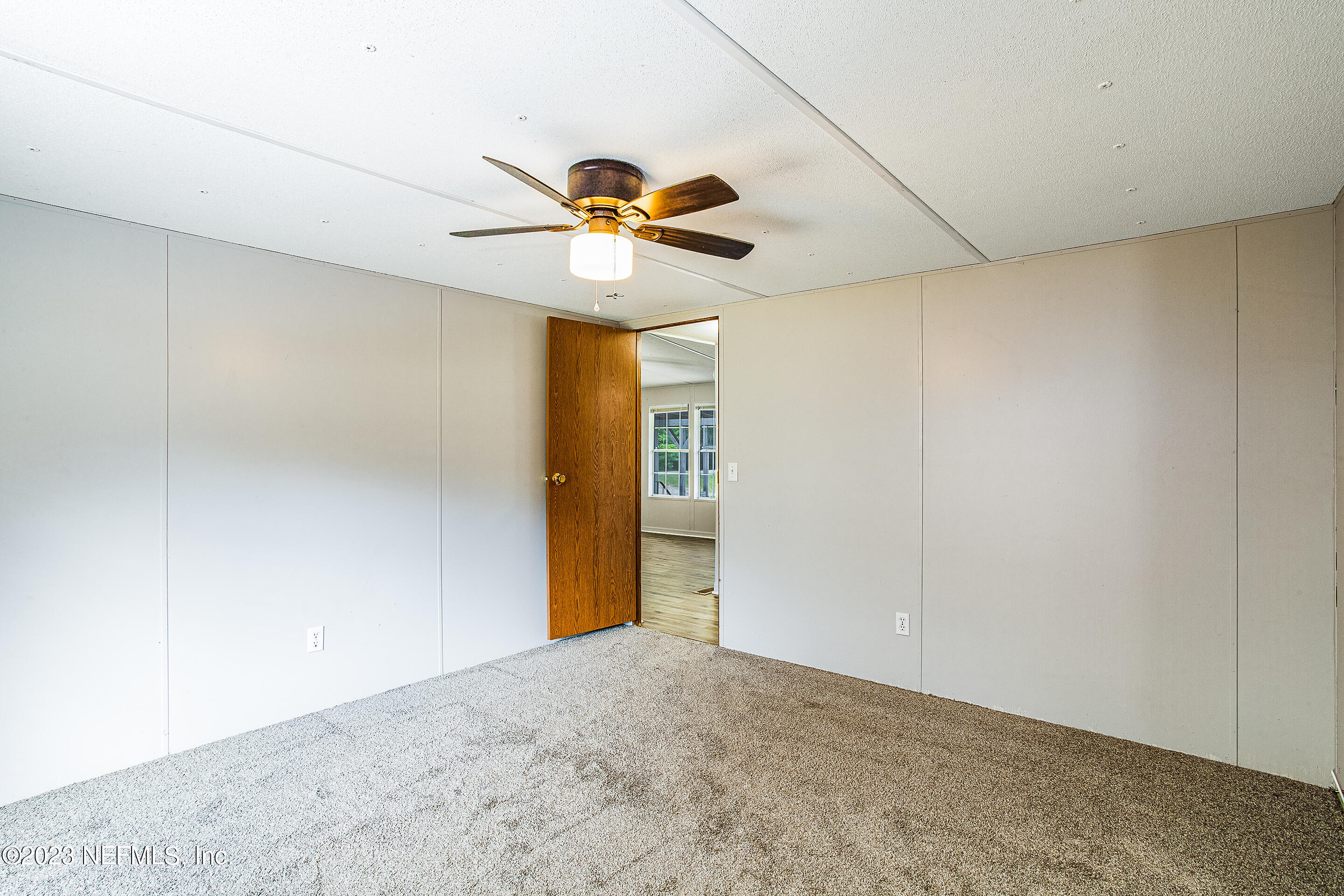 35157 Goodbread Road Callahan, FL 32011 - Photo 11 of 38 a view of a chandelier fan in a room