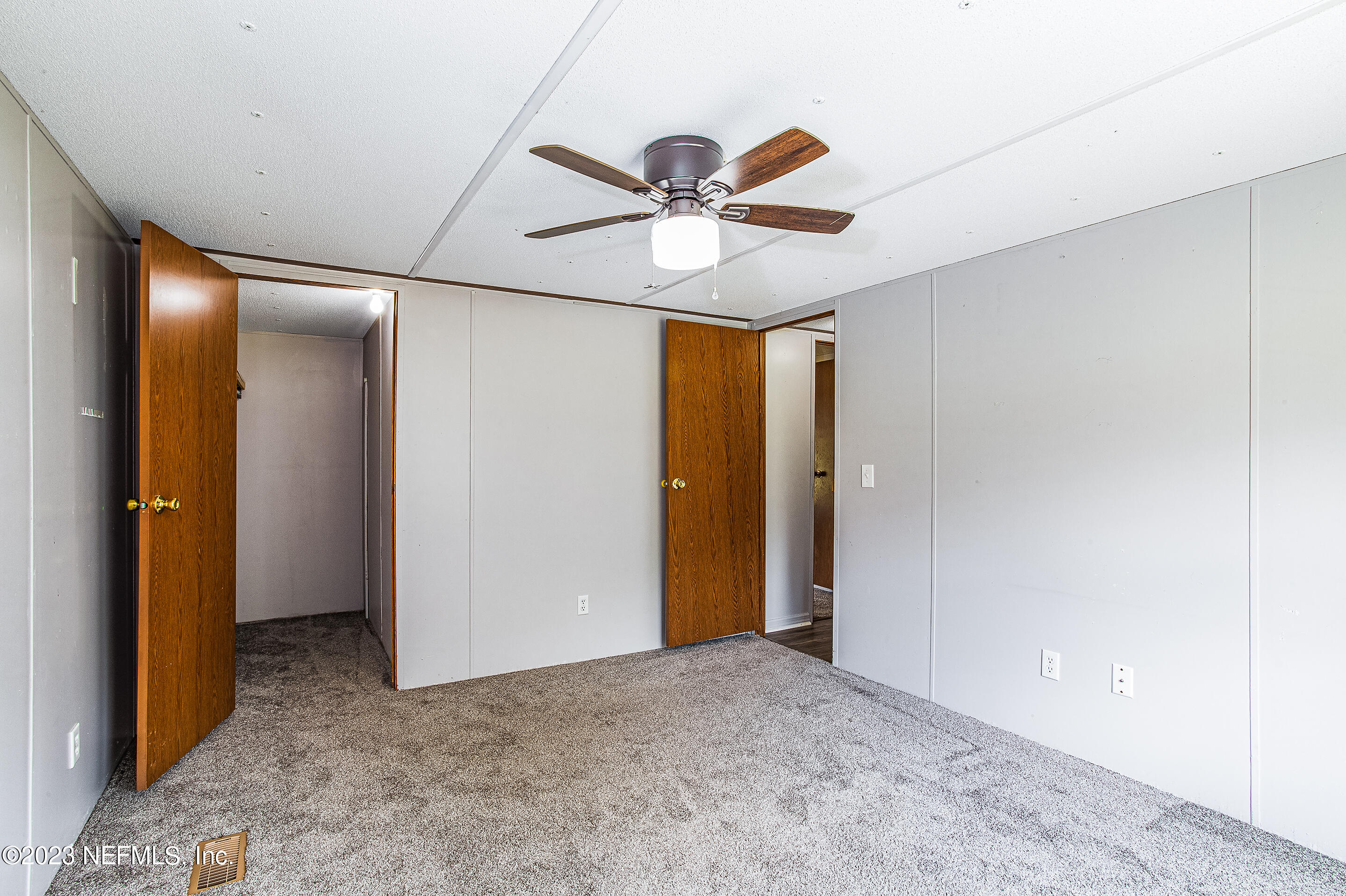 35157 Goodbread Road Callahan, FL 32011 - Photo 14 of 38 a view of a livingroom with a ceiling fan and window