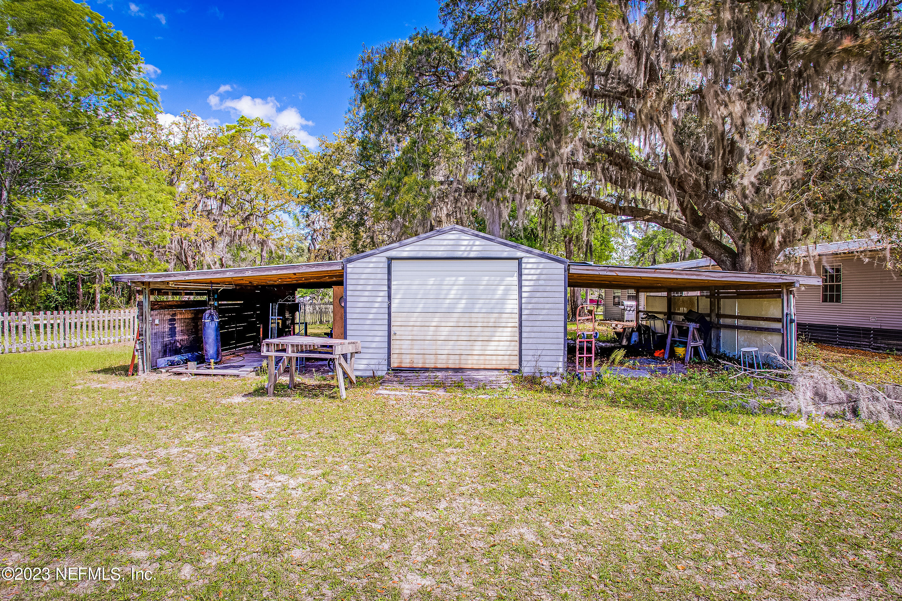 35157 Goodbread Road Callahan, FL 32011 - Photo 36 of 38 a view of a house with patio and a yard