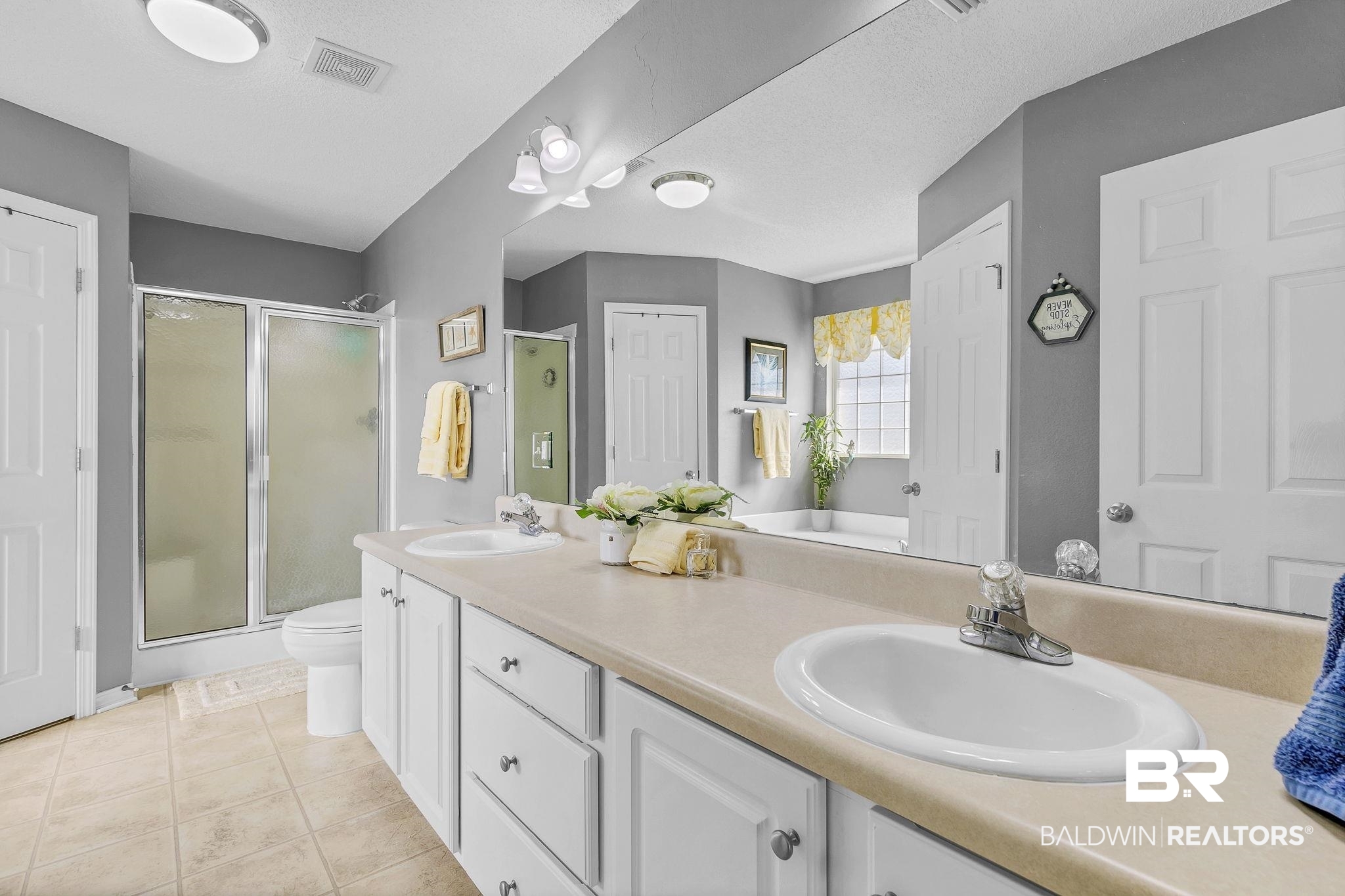 16358 Tempest Drive Foley, AL 36535 - Photo 25 of 46 Full bathroom featuring a sink, visible vents, and a stall shower