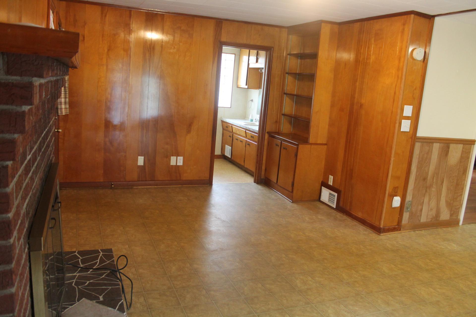 109 Villa Road Ridgeway, VA 24148 - Photo 13 of 32 a view of a hallway with wooden floor