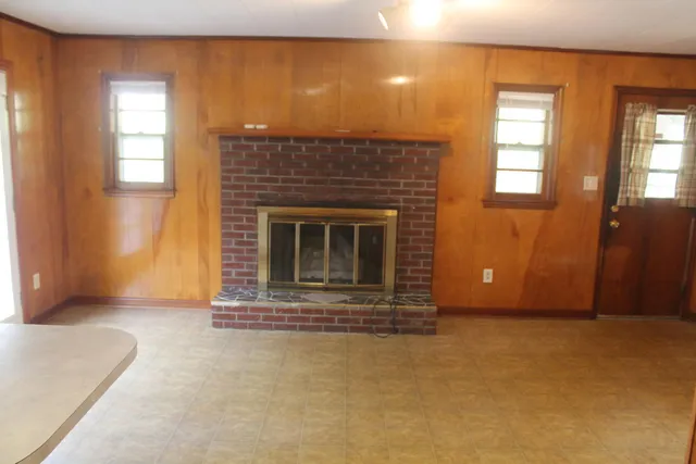 an empty room with a fireplace