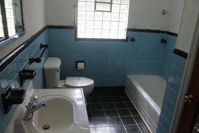 a bathroom with a sink a toilet and a bathtub