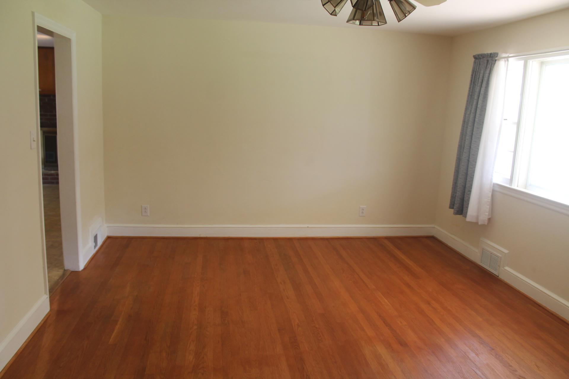 109 Villa Road Ridgeway, VA 24148 - Photo 7 of 32 a view of a room with wooden floor and a window
