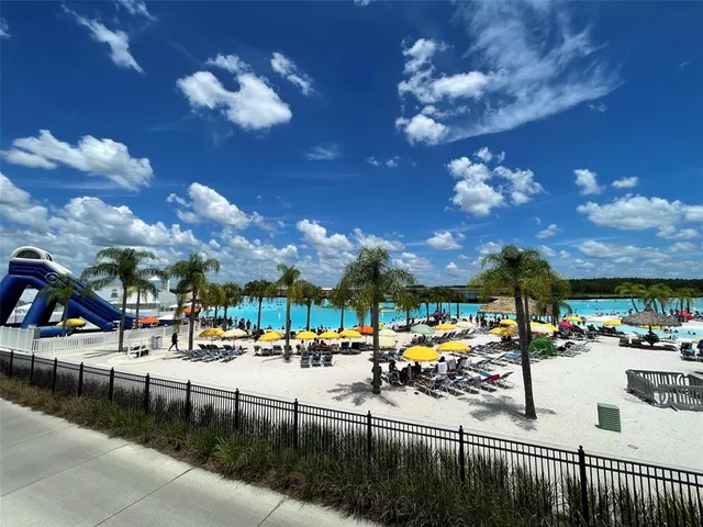 a view of a swimming pool with a table and chairs