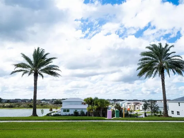 a view of a park and a lot of houses