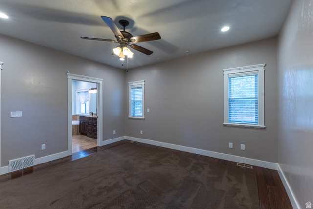 3565 West 1350th Street North Vernal, UT 84078 - Photo 18 of 54 Spacious room featuring a ceiling fan with integrated lighting, recessed lighting, and two windows with blinds