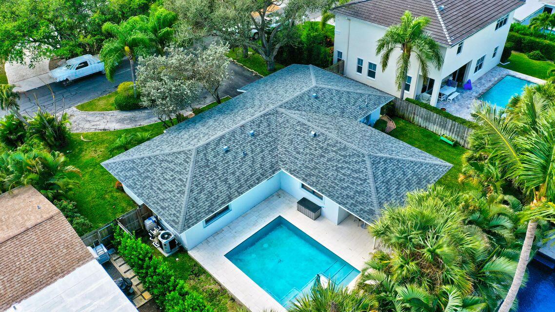 a bird view of house with yard and green space