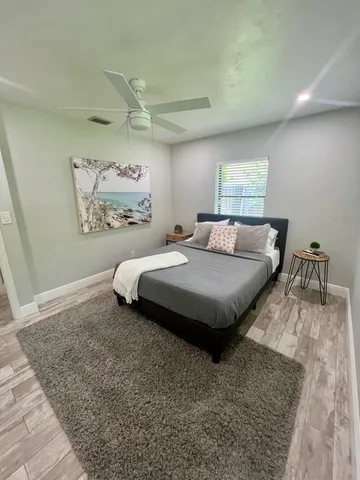 a bedroom with a bed and a couch