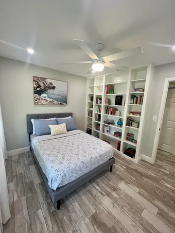a bedroom with a bed and closet