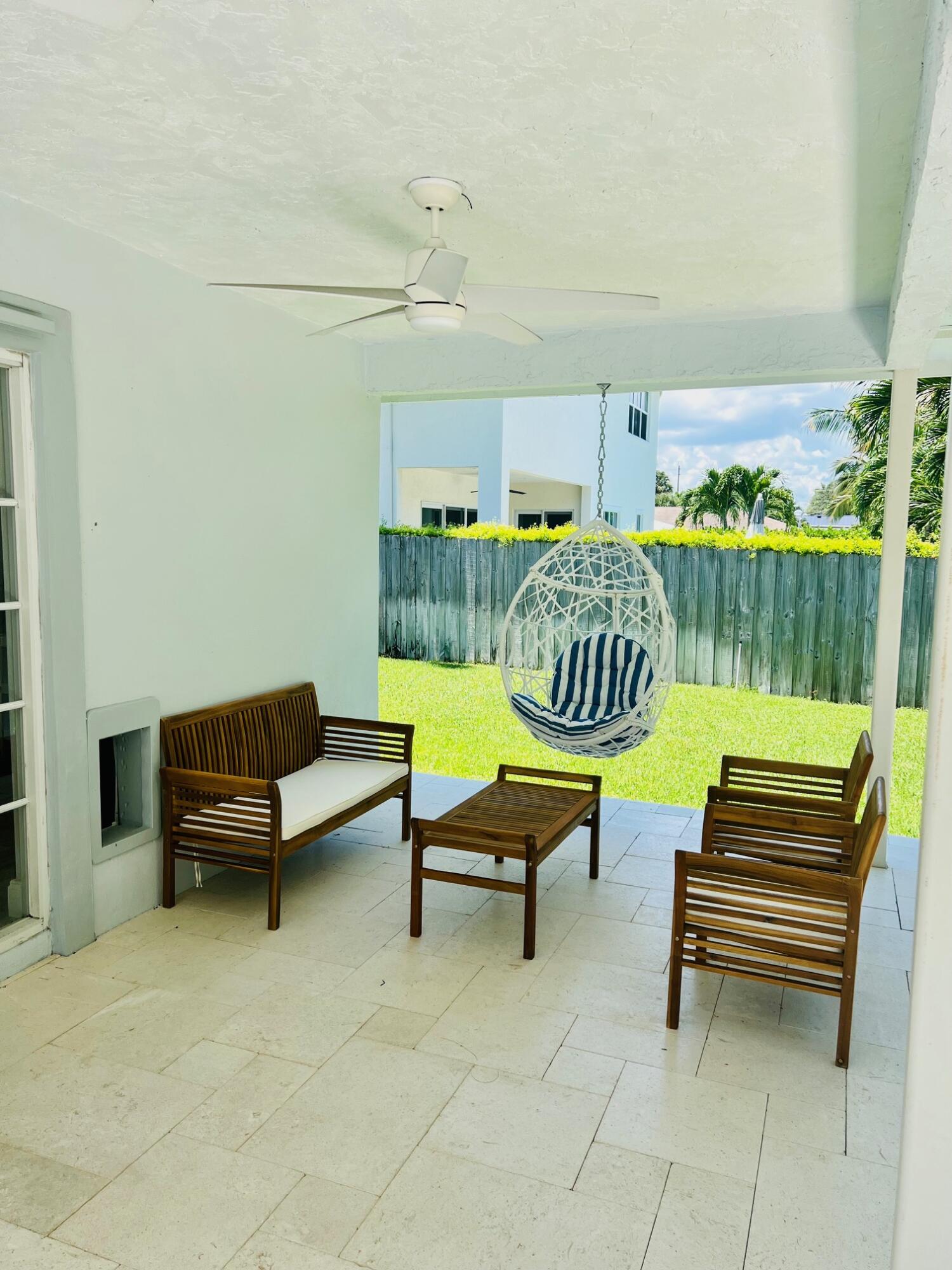 115 Northeast 18th Street Delray Beach, FL 33444 - Photo 24 of 36 a building outdoor space with patio furniture and a potted plants
