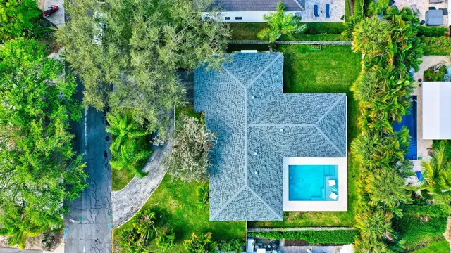 an aerial view of a house with a garden