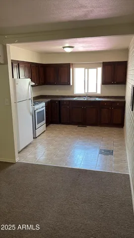 a view of kitchen with a sink