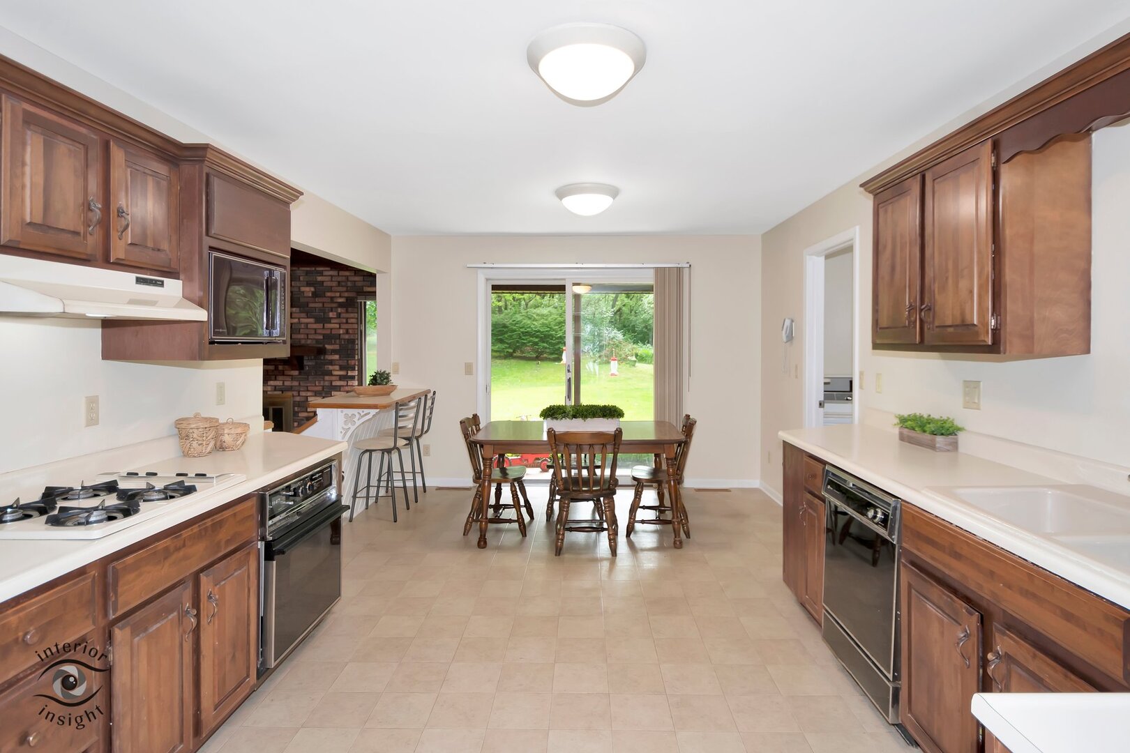 20 Deerfield Avenue Kankakee, IL 60901 - Photo 5 of 36 a kitchen with stainless steel appliances granite countertop sink stove top oven and cabinets