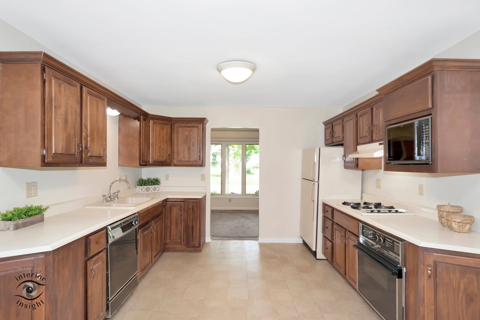 20 Deerfield Avenue Kankakee, IL 60901 - Photo 7 of 36 a kitchen with stainless steel appliances a sink stove and cabinets
