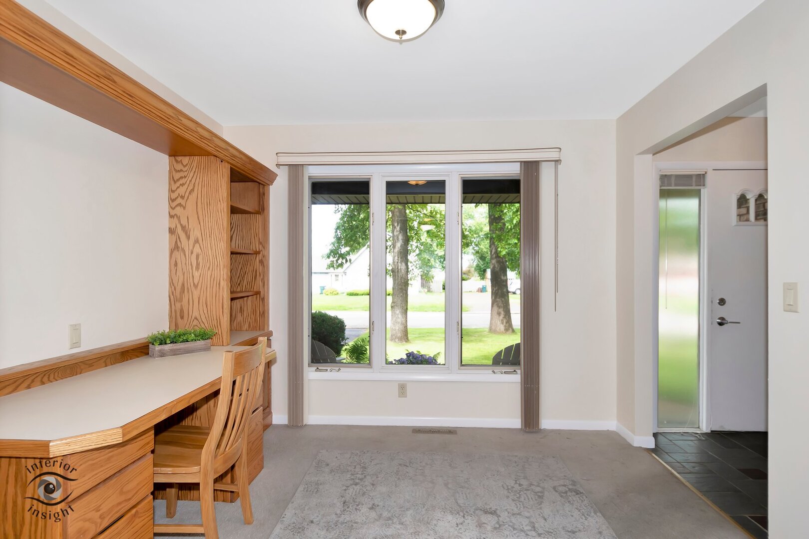 20 Deerfield Avenue Kankakee, IL 60901 - Photo 9 of 36 a view of an empty room with wooden floor and a window