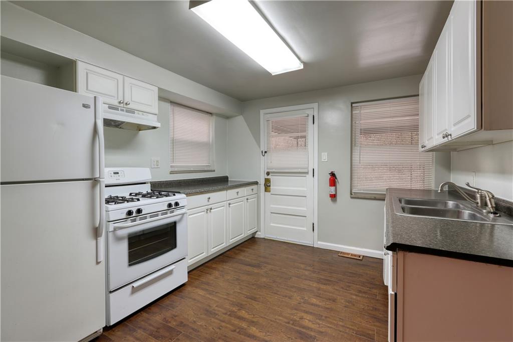 836 Railroad Street McKees Rocks, PA 15136 - Photo 5 of 24 a kitchen with a sink cabinets and stainless steel appliances