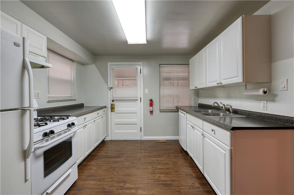 836 Railroad Street McKees Rocks, PA 15136 - Photo 7 of 24 a kitchen with stainless steel appliances a white stove top oven and sink