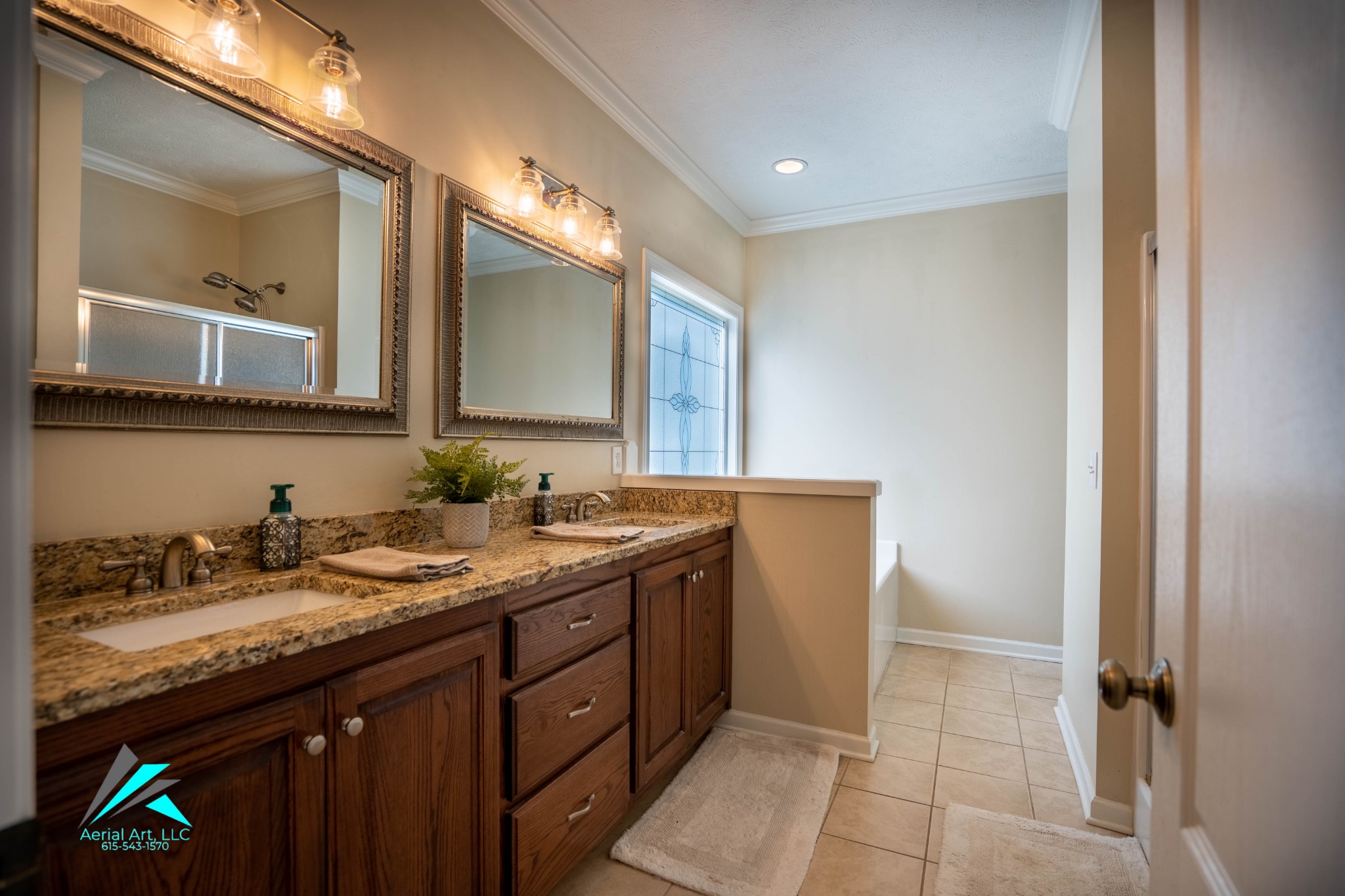 9946 Lebanon Road Murfreesboro, TN 37129 - Photo 12 of 20 a spacious bathroom with a granite countertop sink a mirror and a