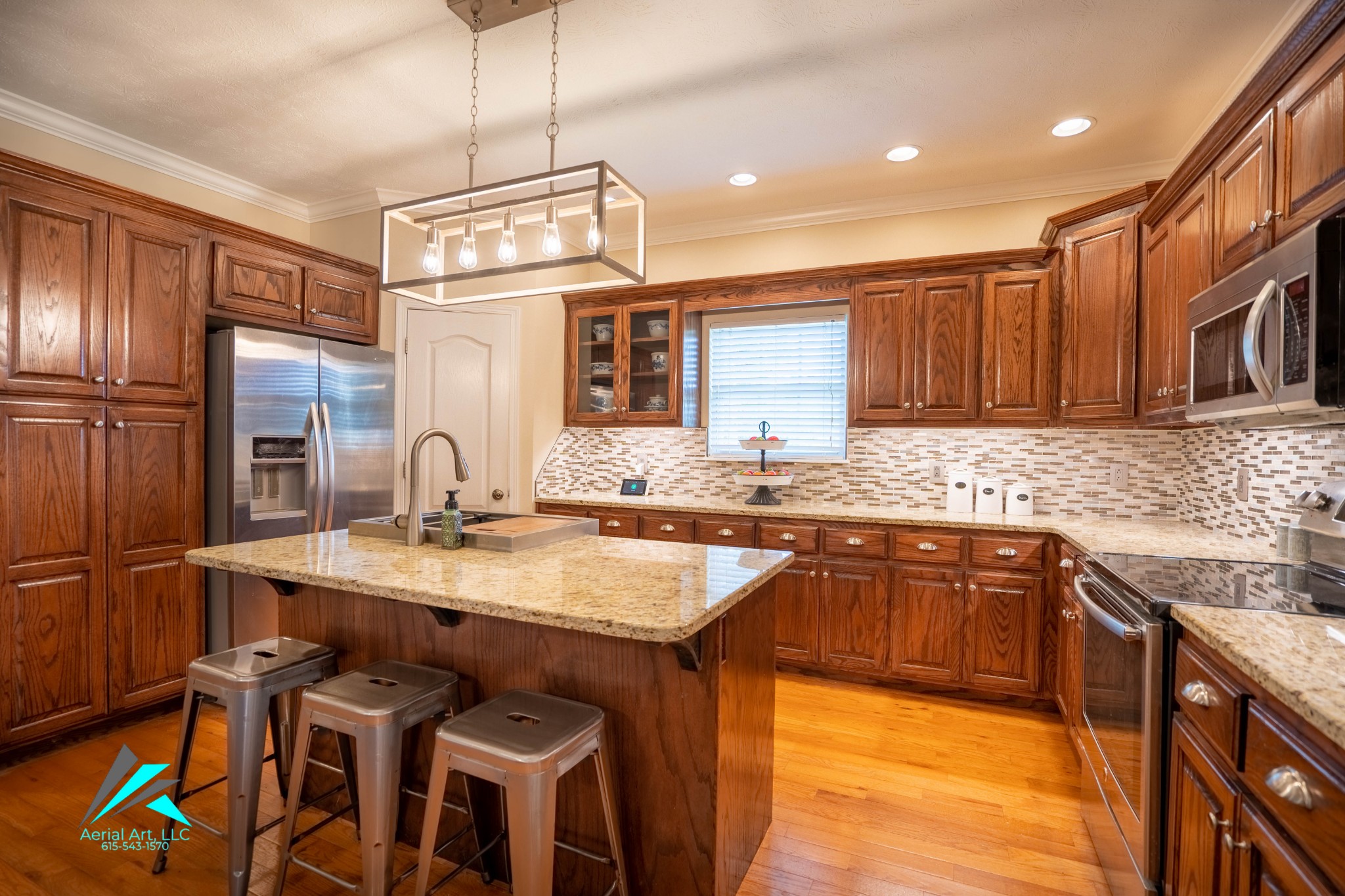 9946 Lebanon Road Murfreesboro, TN 37129 - Photo 6 of 20 a kitchen with granite countertop a sink stove and refrigerator