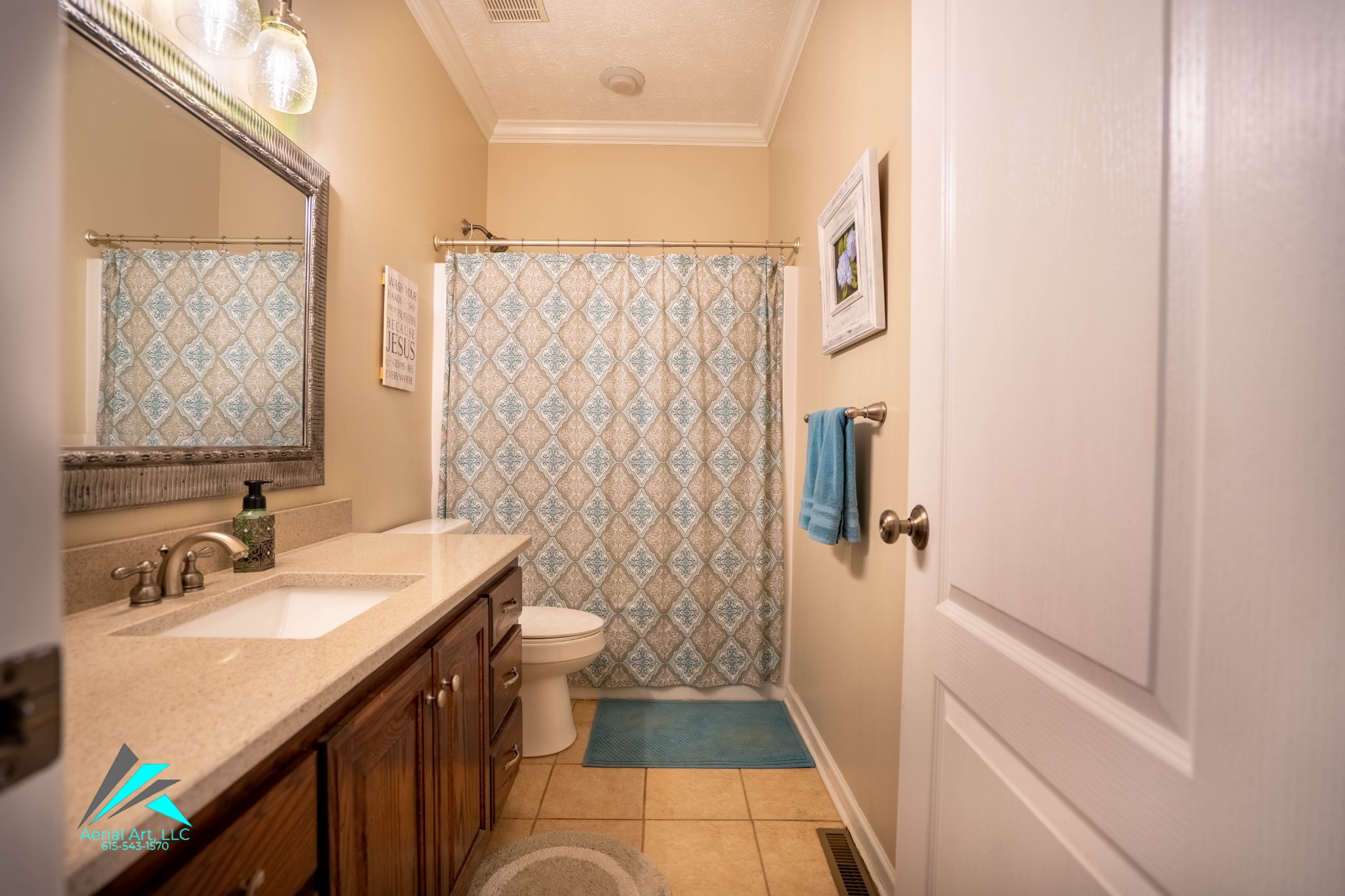9946 Lebanon Road Murfreesboro, TN 37129 - Photo 10 of 20 a bathroom with a sink a toilet a shower and a mirror