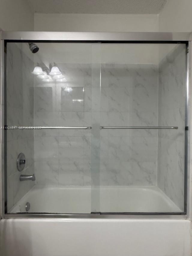 921 Lyons Road, Unit 3205 Coconut Creek, FL 33063 - Photo 15 of 37 a bathroom with a shower