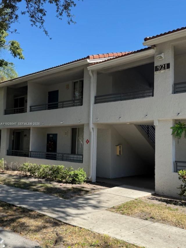 921 Lyons Road, Unit 3205 Coconut Creek, FL 33063 - Photo 2 of 37 a view of building along with street