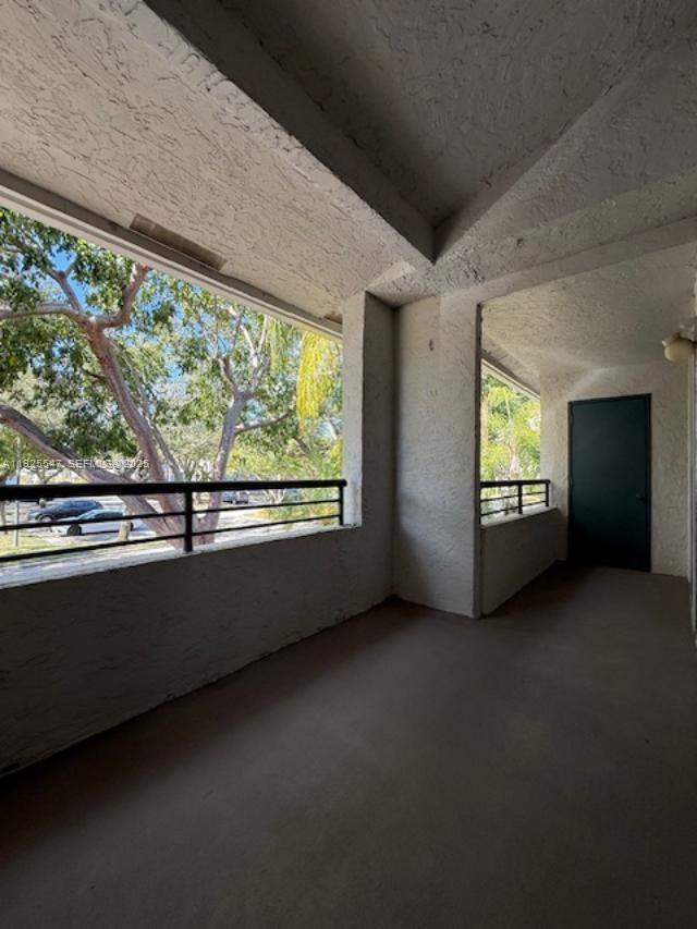 921 Lyons Road, Unit 3205 Coconut Creek, FL 33063 - Photo 22 of 37 a view of an empty room with a window