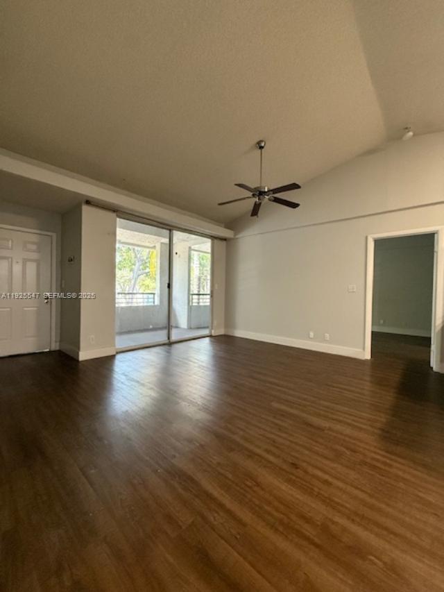 921 Lyons Road, Unit 3205 Coconut Creek, FL 33063 - Photo 3 of 37 an empty room with wooden floor and windows