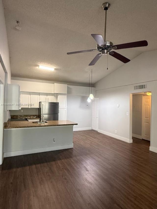 921 Lyons Road, Unit 3205 Coconut Creek, FL 33063 - Photo 7 of 37 a view of a kitchen with a sink and wooden floor