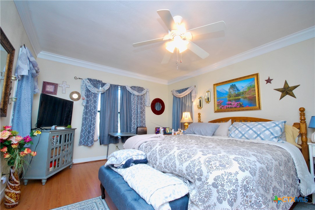 302 South Main Street Schulenburg, TX 78956 - Photo 12 of 39 a living room with furniture and a flat screen tv