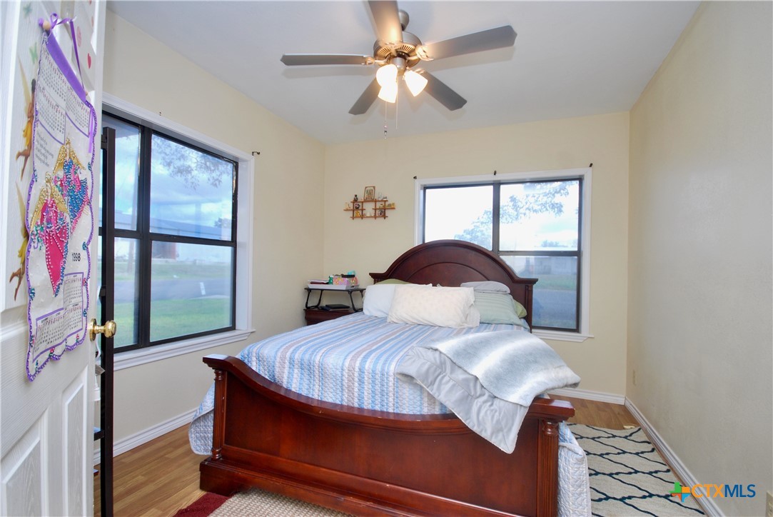 302 South Main Street Schulenburg, TX 78956 - Photo 19 of 39 a bedroom with a bed and a window