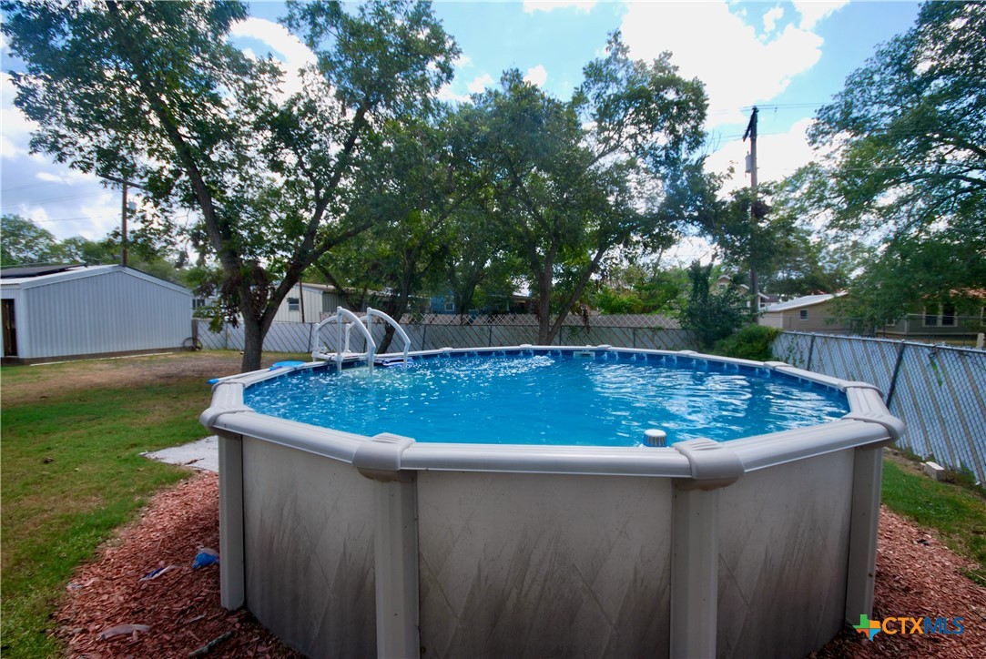 302 South Main Street Schulenburg, TX 78956 - Photo 30 of 39 a view of a yard with large trees