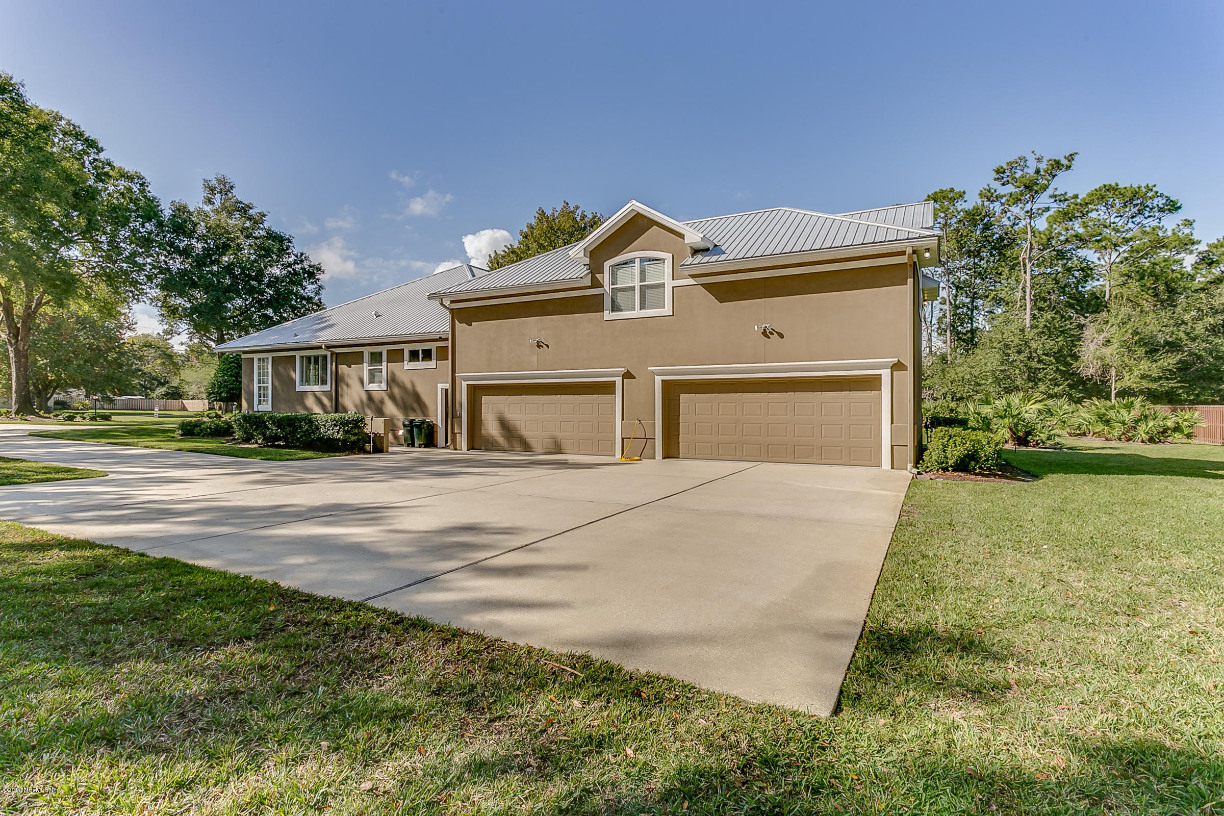 4641 Raggedy Point Road Fleming Island, FL 32003 - Photo 42 of 49 Rear Entry 4-Car Garage