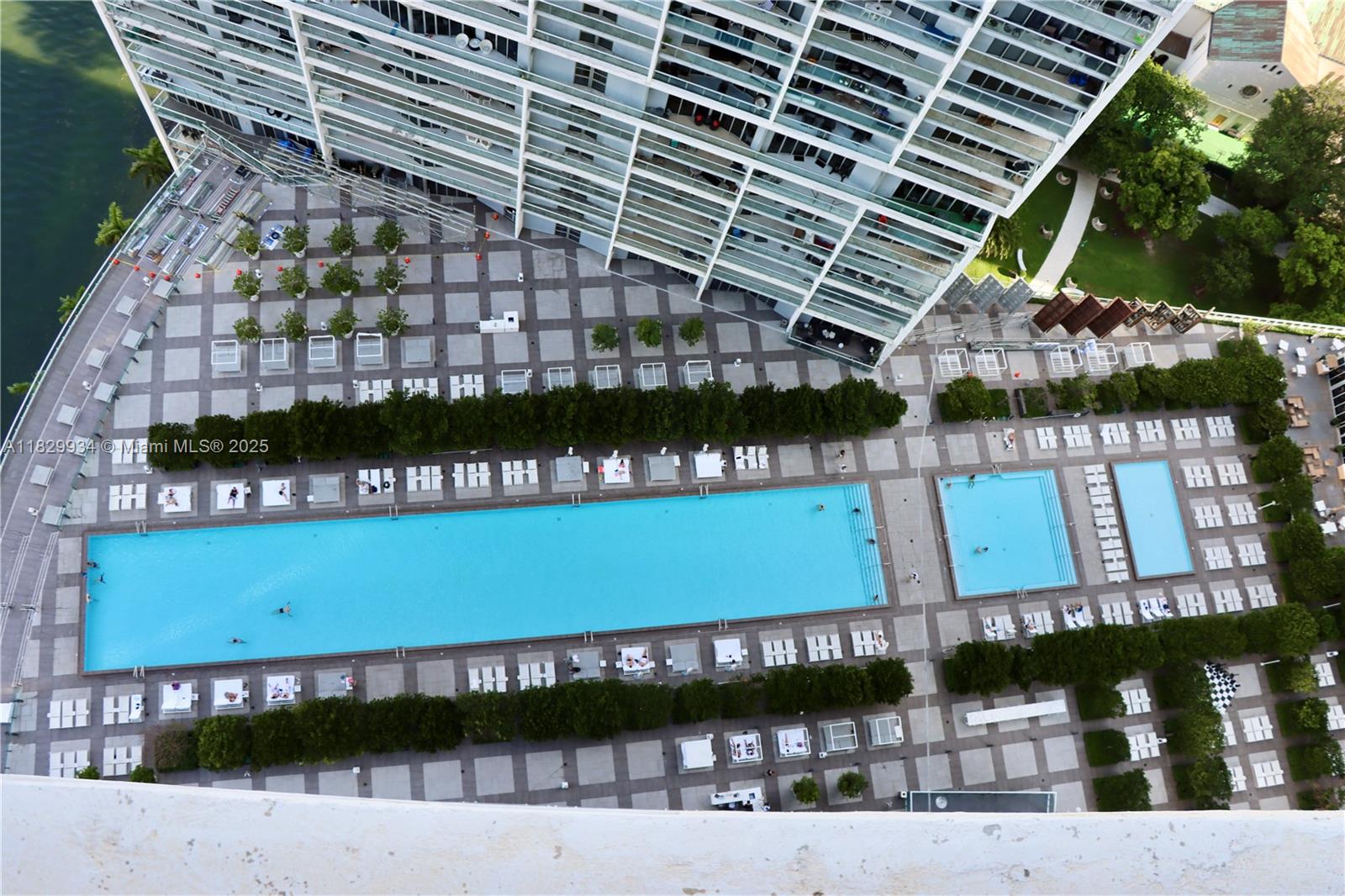 475 Brickell Avenue, Unit 4207 Miami, FL 33131 - Photo 18 of 26 a view of a swimming pool with outdoor seating