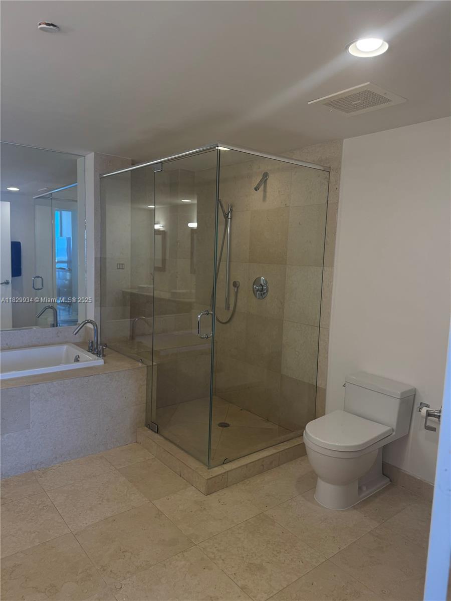 475 Brickell Avenue, Unit 4207 Miami, FL 33131 - Photo 7 of 26 a bathroom with a shower a toilet and sink