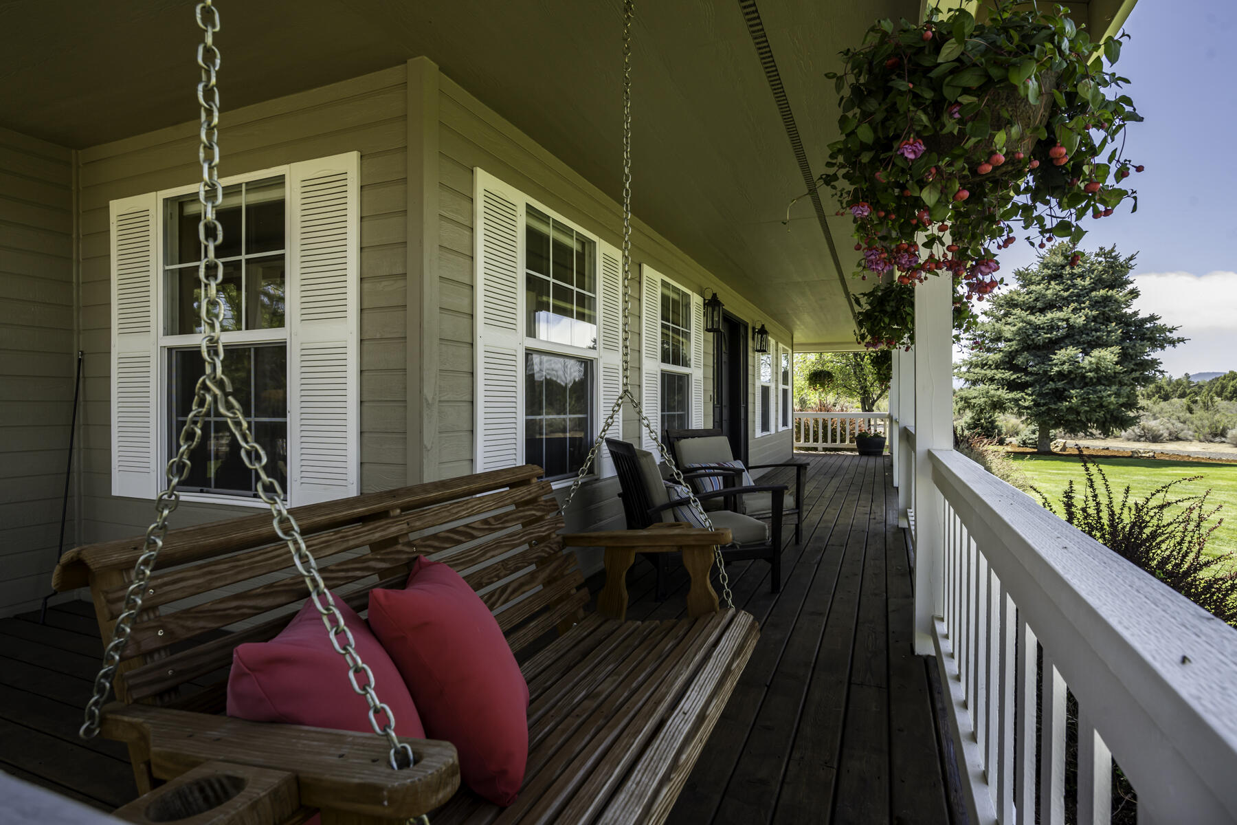61030 Jennings Road Bend, OR 97702 - Photo 6 of 76 a balcony filled with lots of potted plants