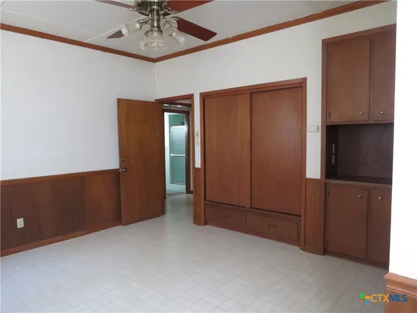 an empty room with closet area