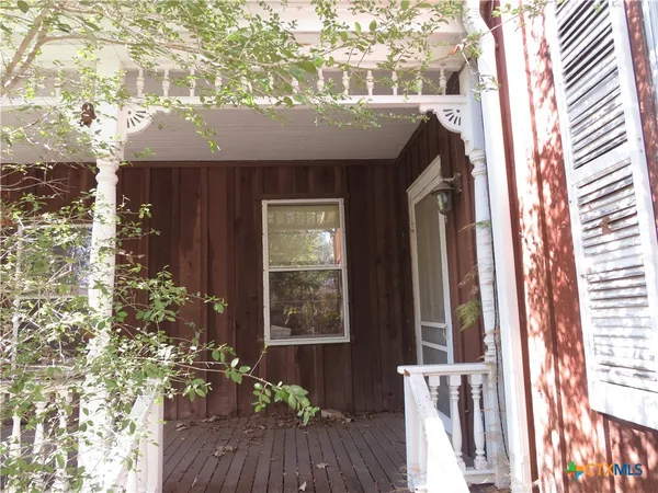 a view of house with wooden floor and a potted plant