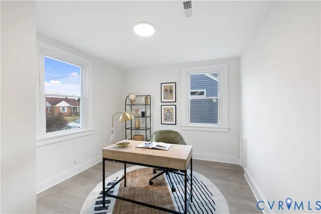 a living room with furniture and window