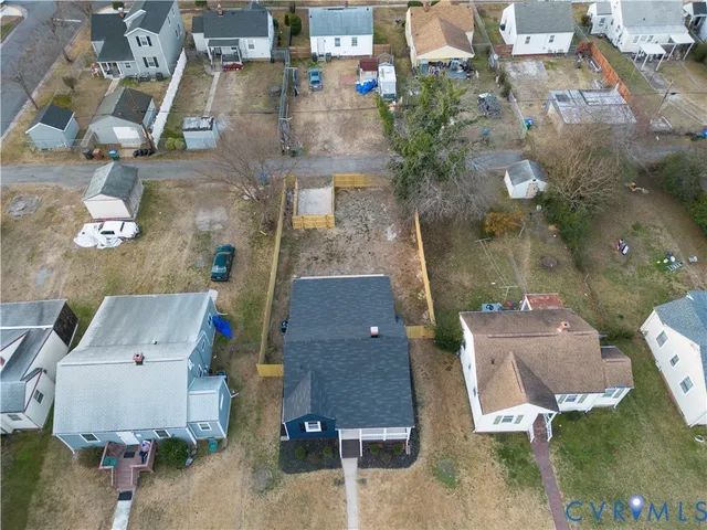 an aerial view of residential houses with outdoor space
