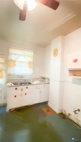 a kitchen with a sink and a stove