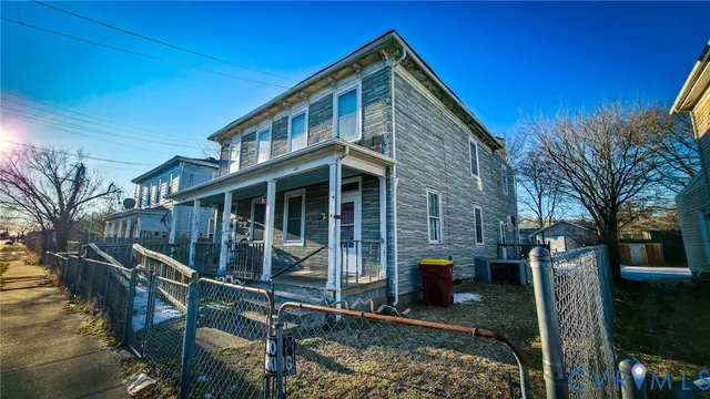 a front view of a house with parking walls