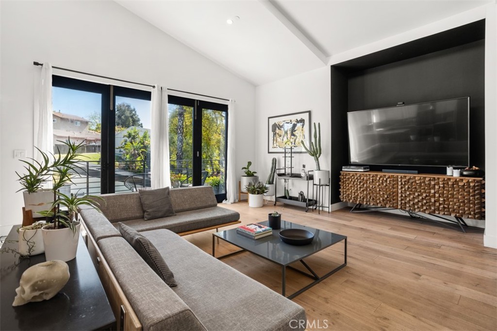 950 El Paso Drive Los Angeles, CA 90042 - Photo 14 of 52 a living room with furniture and a flat screen tv