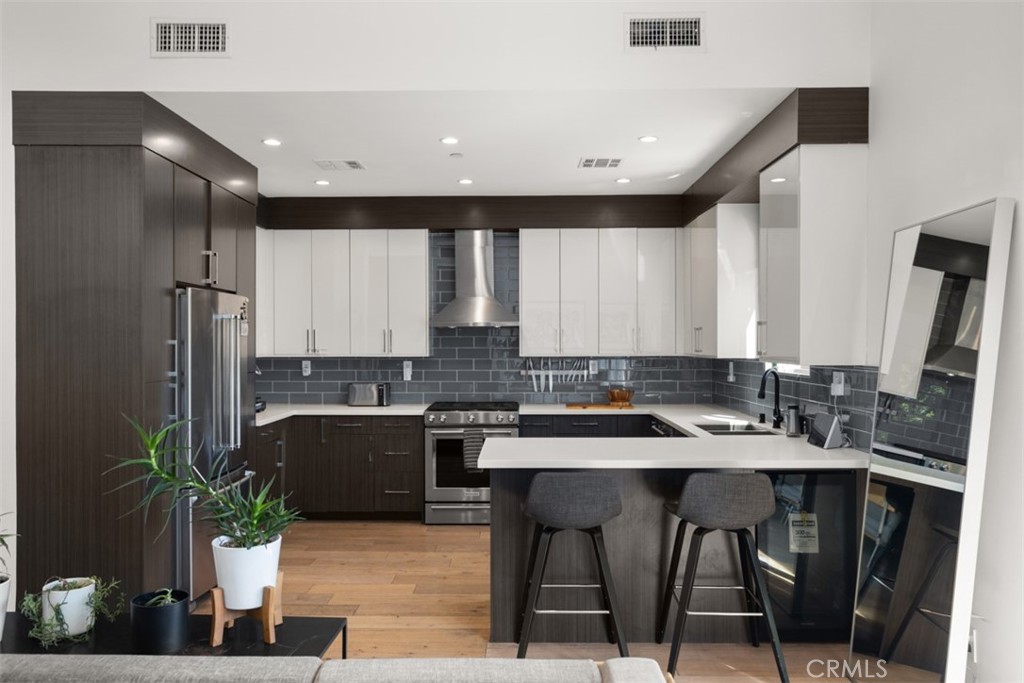 950 El Paso Drive Los Angeles, CA 90042 - Photo 19 of 52 a kitchen with a table and chairs in it