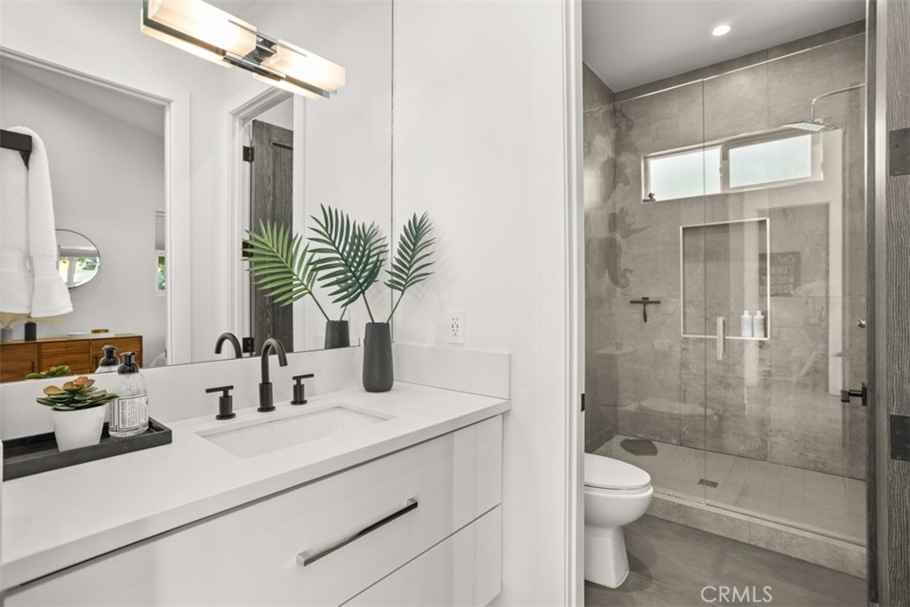 950 El Paso Drive Los Angeles, CA 90042 - Photo 23 of 52 a bathroom with a sink a toilet and shower