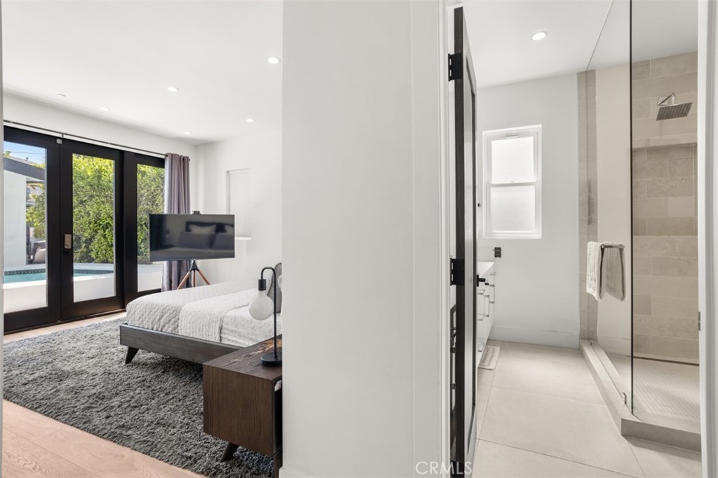 950 El Paso Drive Los Angeles, CA 90042 - Photo 31 of 52 a bedroom with a bed and a mirror