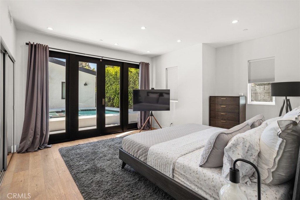 950 El Paso Drive Los Angeles, CA 90042 - Photo 32 of 52 a bedroom with a bed and a large window