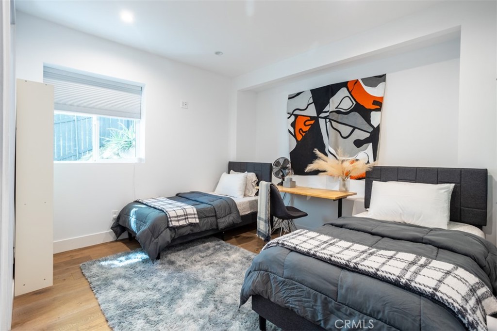 950 El Paso Drive Los Angeles, CA 90042 - Photo 34 of 52 a bedroom with two beds and a painting on the wall